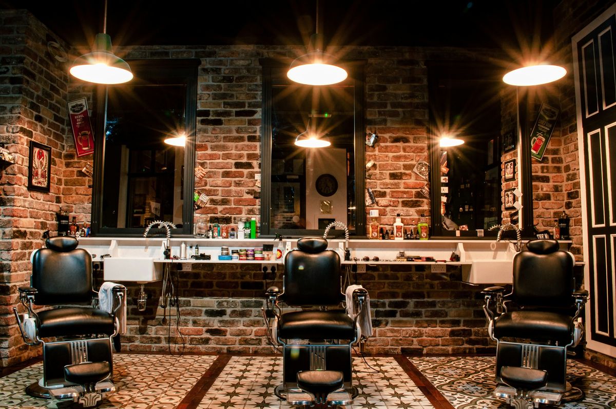 A barbershop with its chairs waiting for clients